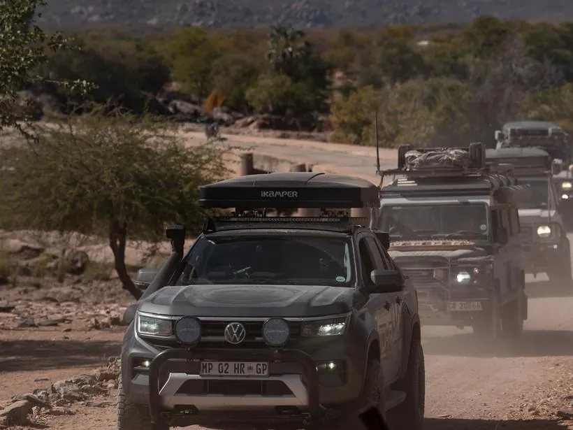 A wide desert horizon with the convoy small against it